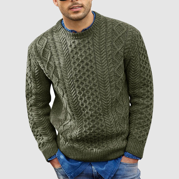 Men's cable knit crew neck jumper Zevran in Military Green – front view worn over a denim shirt
