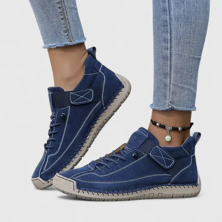 Women's lace up trainers Yvie in Blue – on foot side view