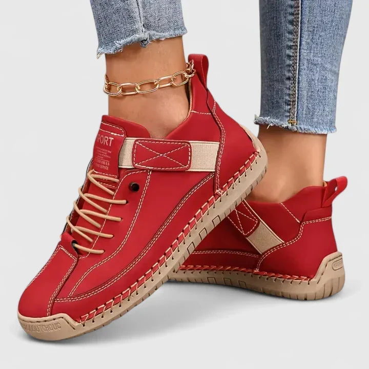 Women's lace up trainers Yvie in Red – on foot side view