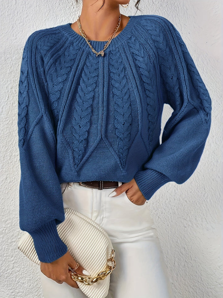 Women's cable knit jumper Ulla in Navy – model view with clutch