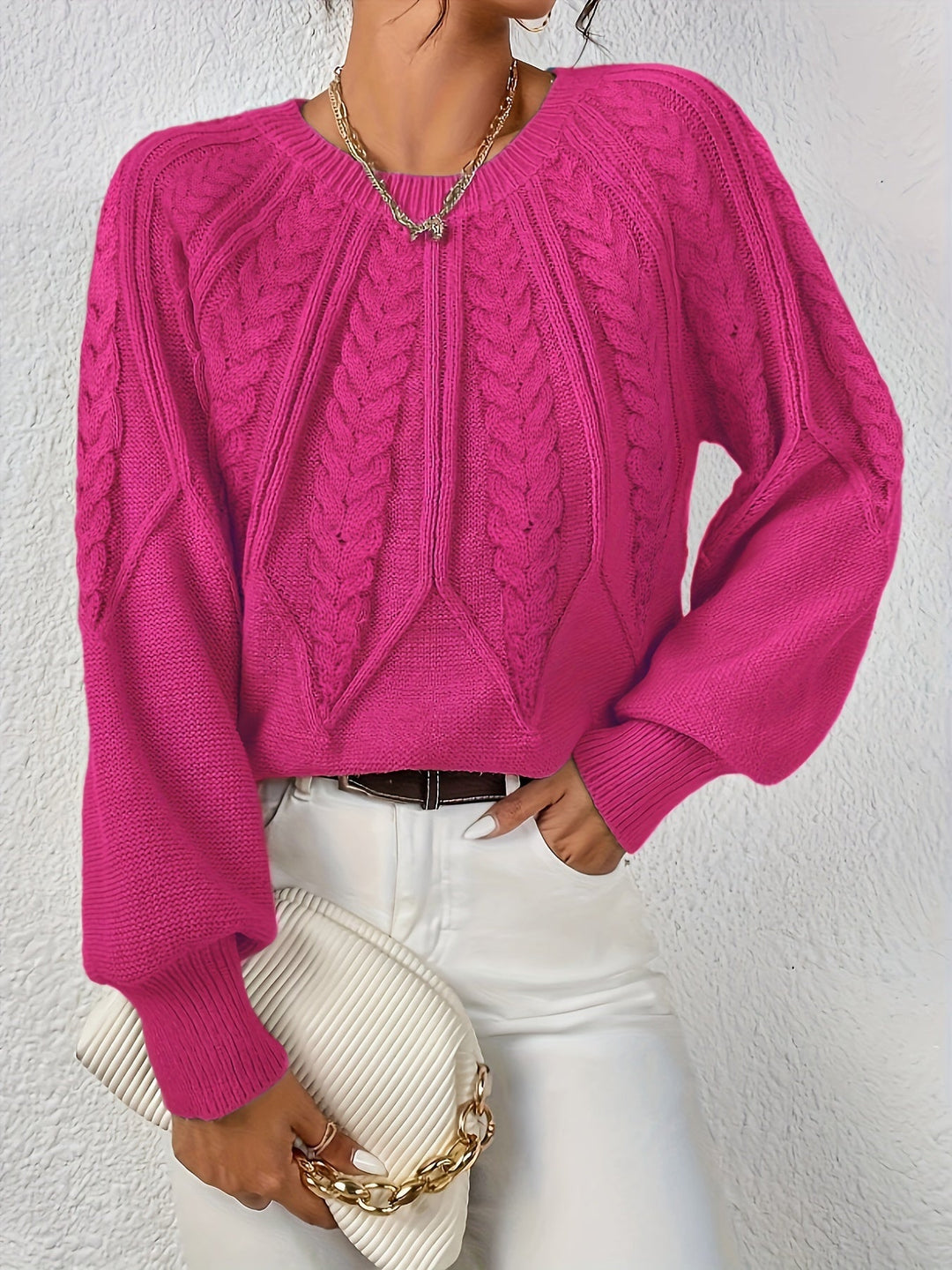 Women's cable knit jumper Ulla in Rose Red – model view with clutch