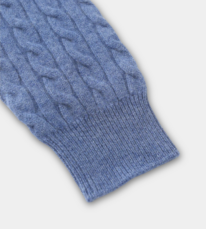 Blue cable knit quarter zip jumper – close-up of ribbed cuff