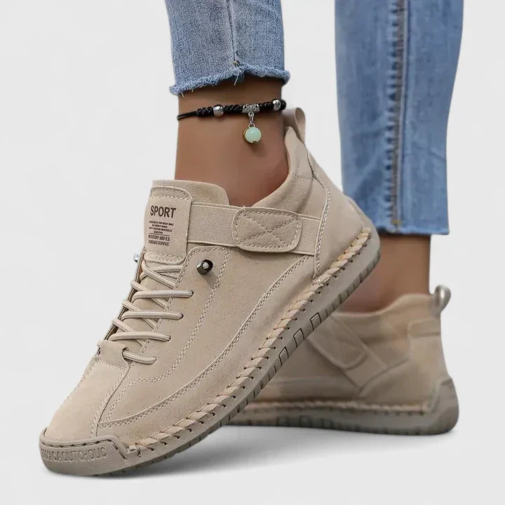 Women's lace up trainers Yvie in Beige – on foot side view
