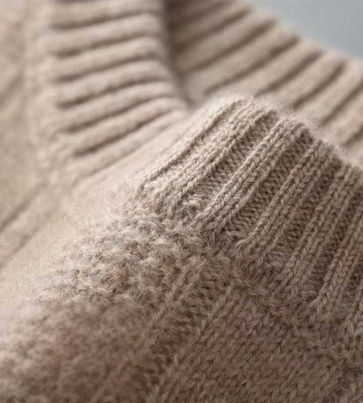 Dark beige cable knit jumper – close-up of ribbed neckline
