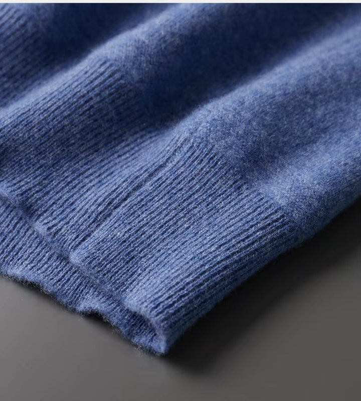 Blue knitted polo jumper – close-up of ribbed hem