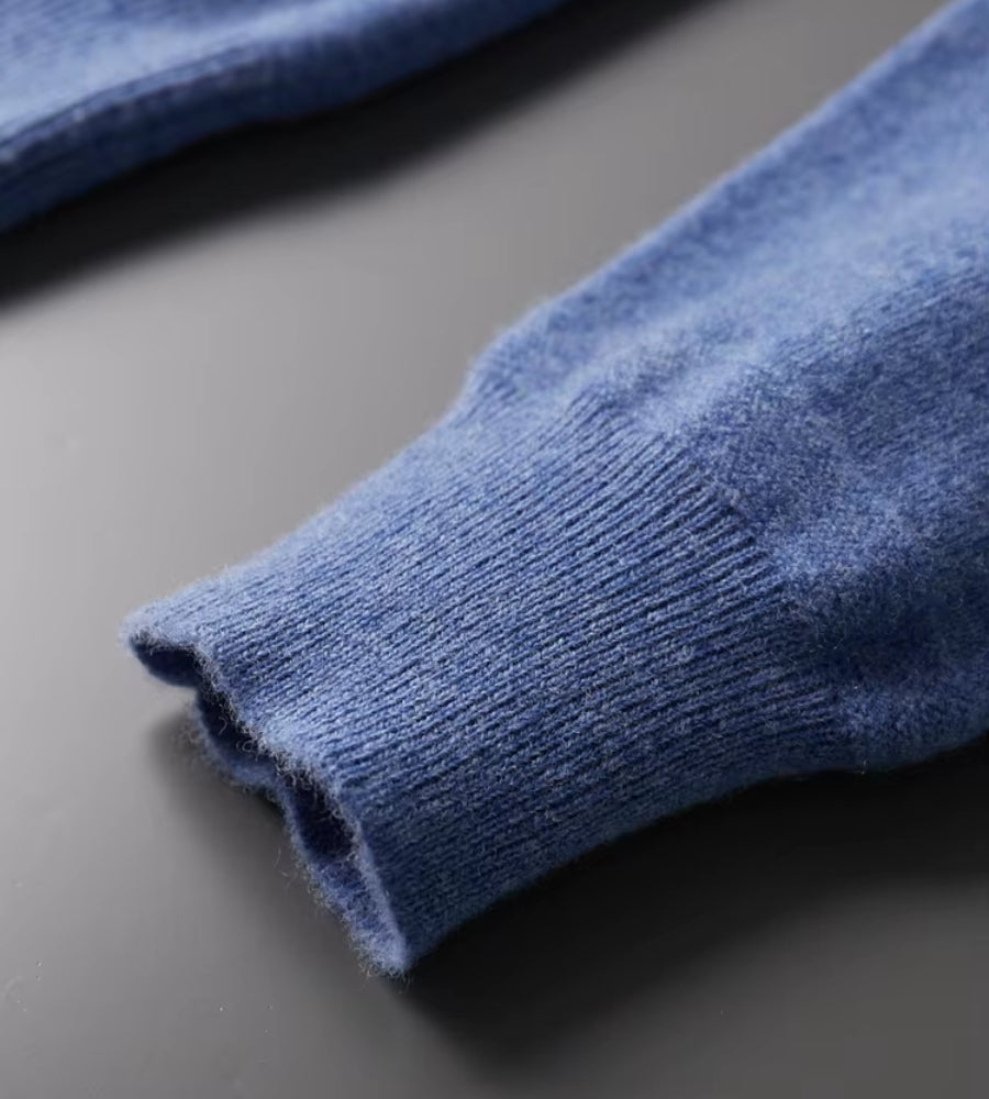 Blue knitted polo jumper – close-up of ribbed cuff