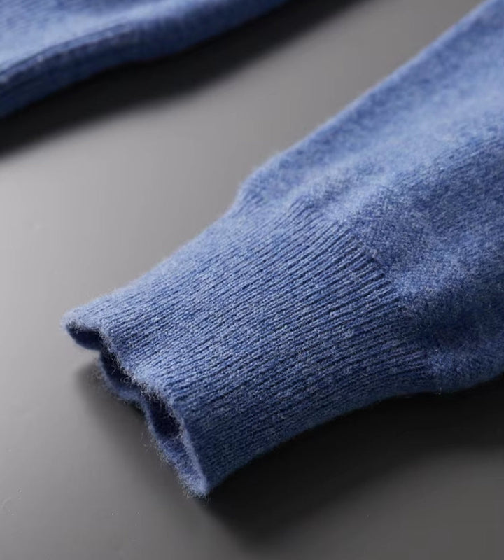 Blue knitted polo jumper – close-up of ribbed cuff