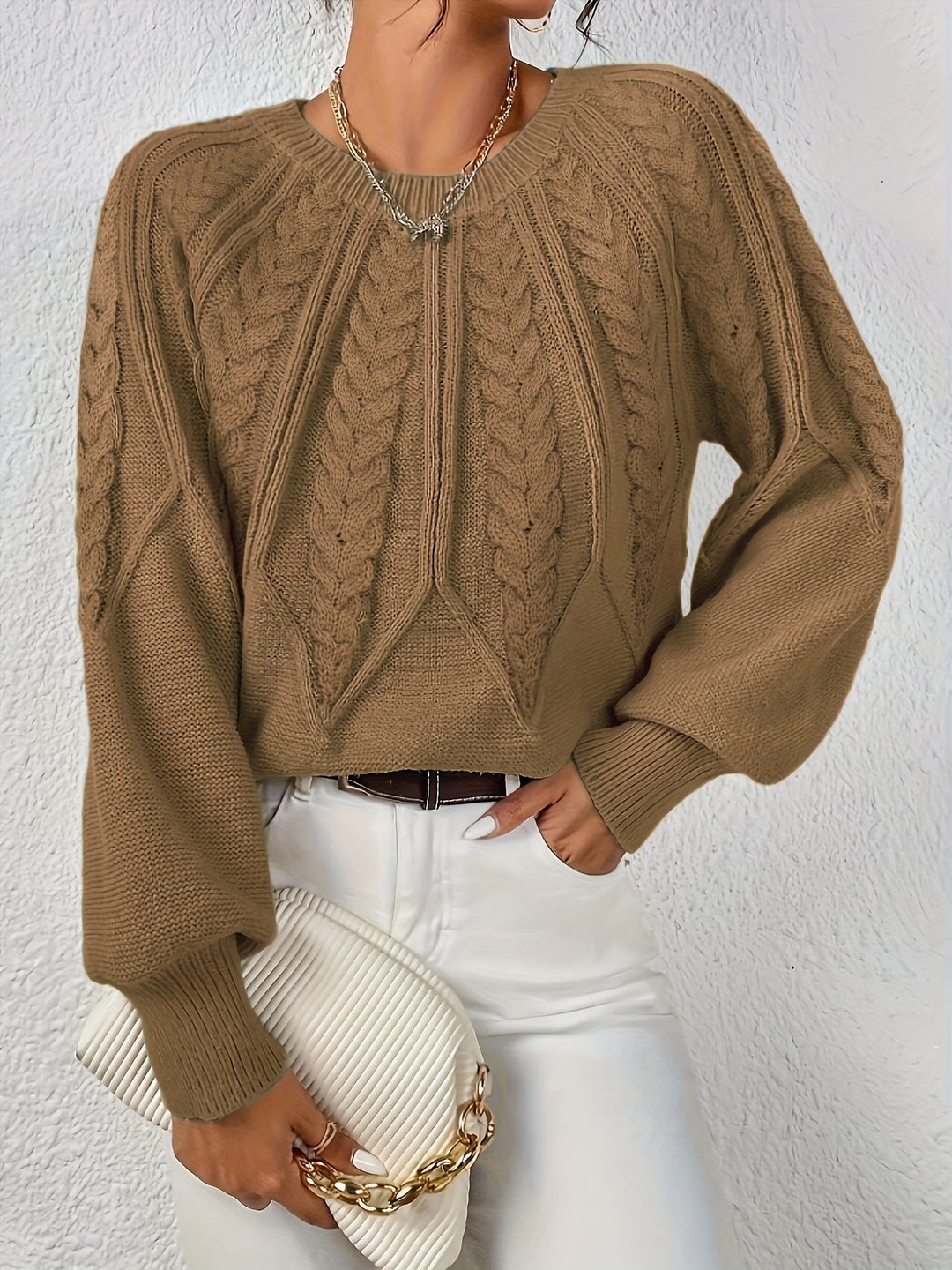 Women's cable knit jumper Ulla in Camel – model view with clutch