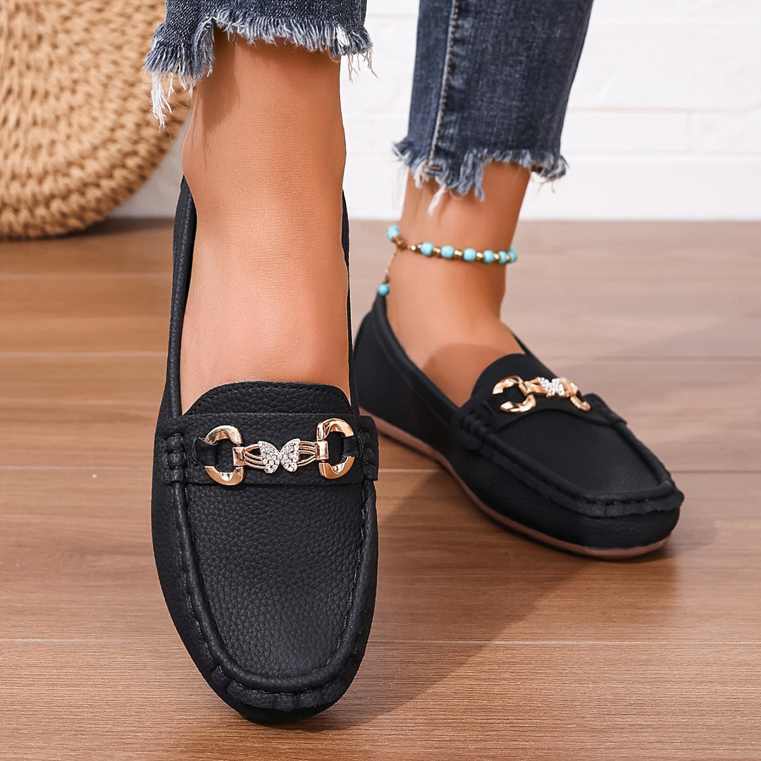Women's flat loafers Bettina in Black – worn front view