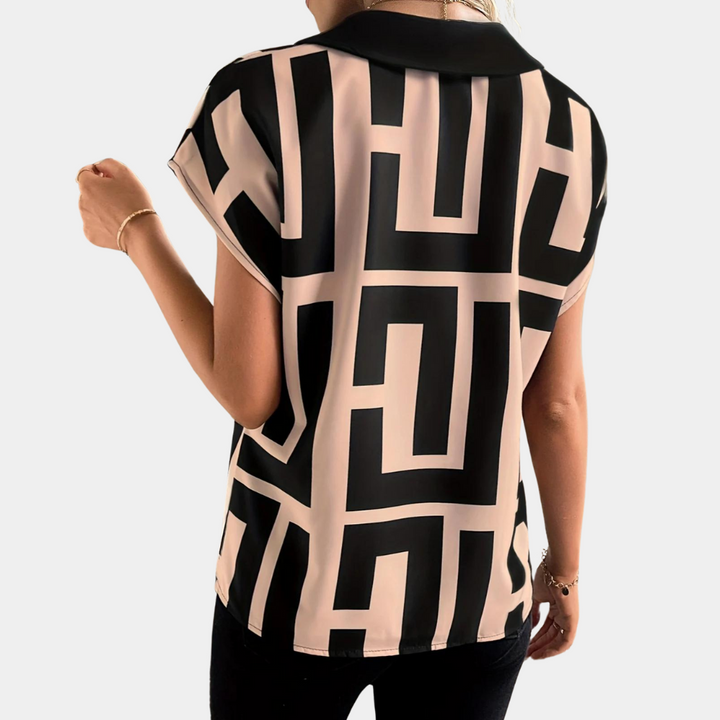 Velora geometric print V-neck blouse in black and nude – back view