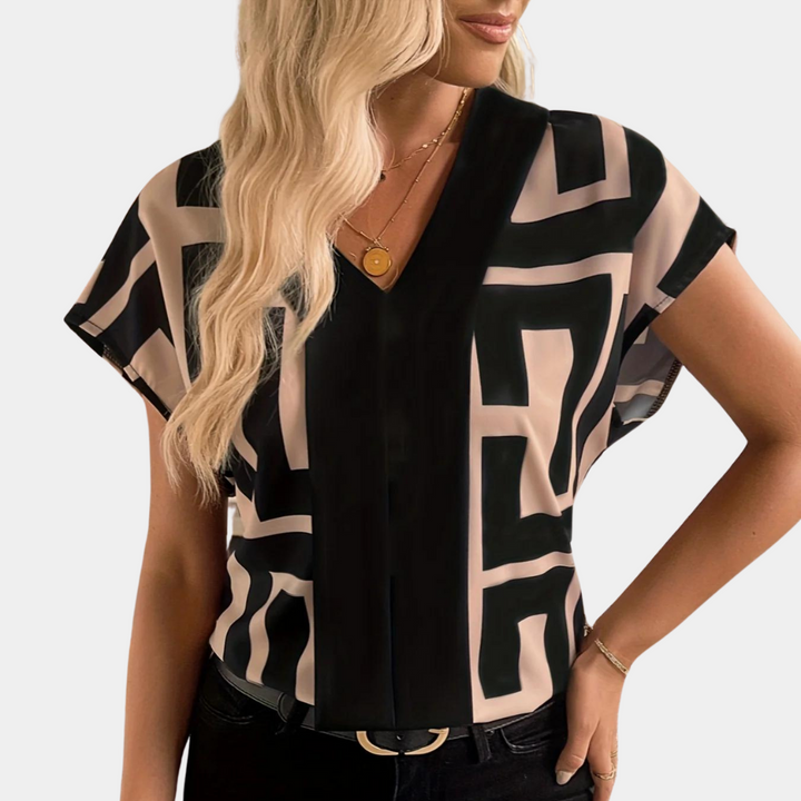 Velora geometric print V-neck blouse in black and nude – front close-up