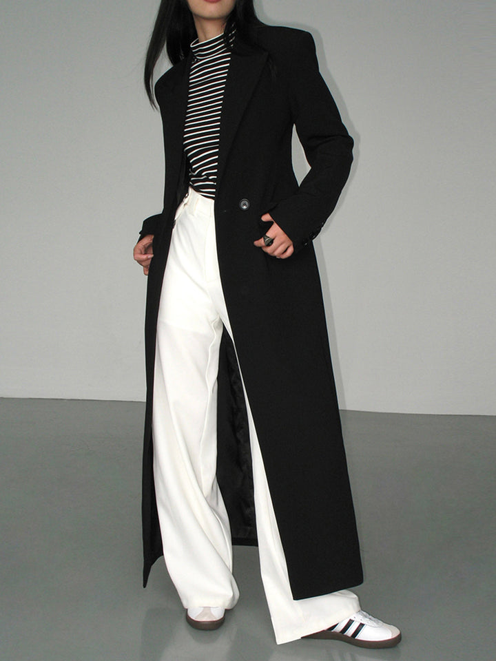 Women's black long coat Petra in Black – styled view with trousers