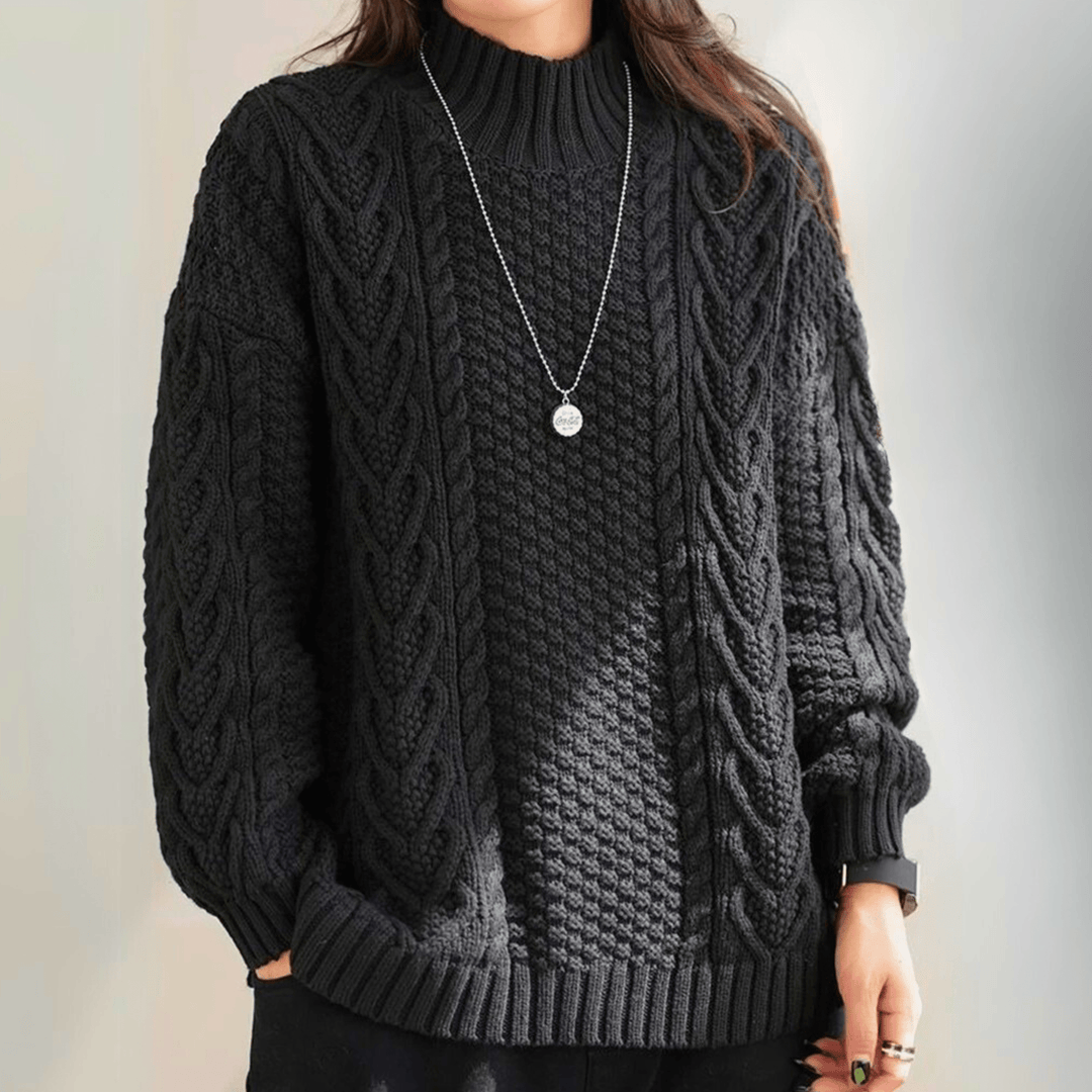 Gail - Women's chunky cable knit mock neck jumper in Black – front view