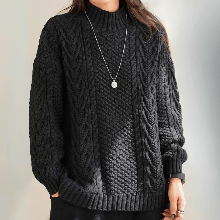 Gail - Women's chunky cable knit mock neck jumper in Black – front view