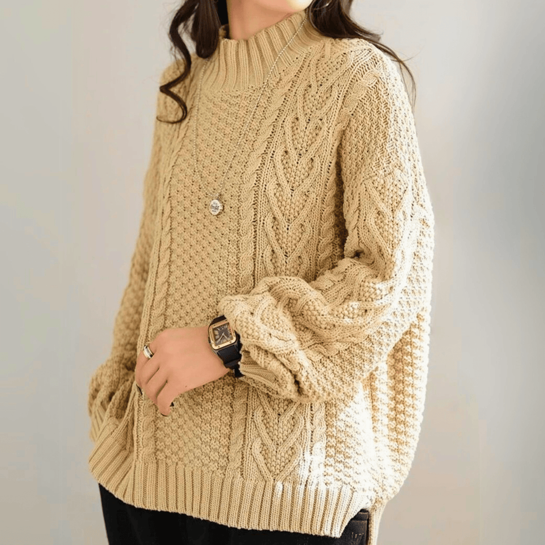 Gail - Women's chunky cable knit mock neck jumper in Sand – side view