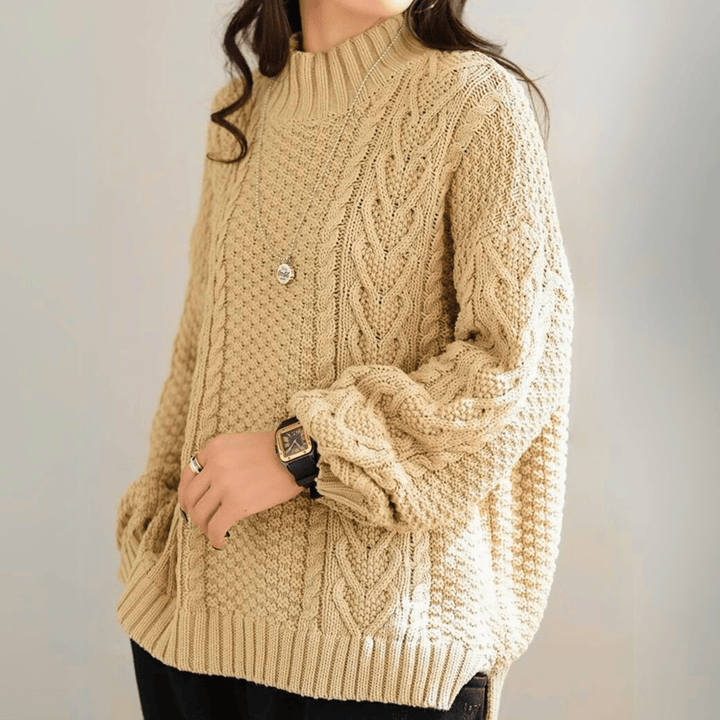 Gail - Women's chunky cable knit mock neck jumper in Sand – side view
