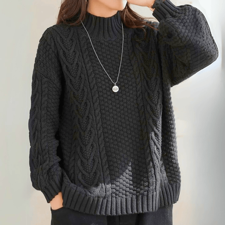 Gail - Women's chunky cable knit mock neck jumper in Black – front view