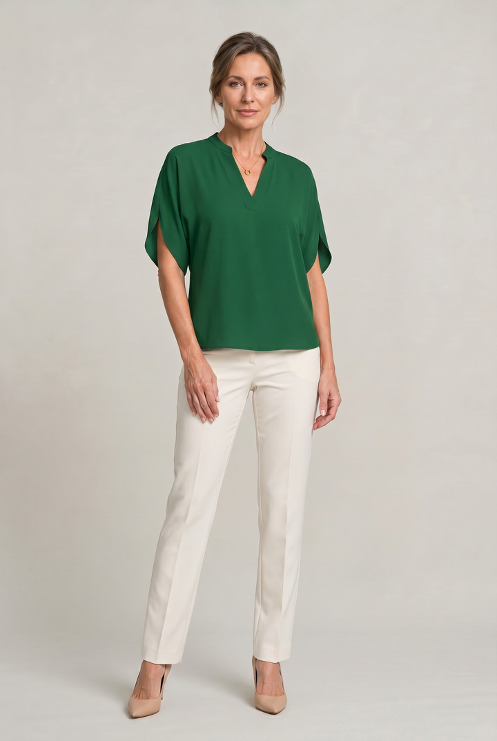 Rosalind notch V-neck petal sleeve top in Light Blue – worn by model