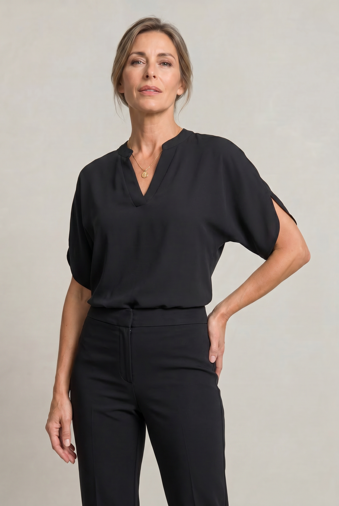 Rosalind notch V-neck petal sleeve top in Black – front view