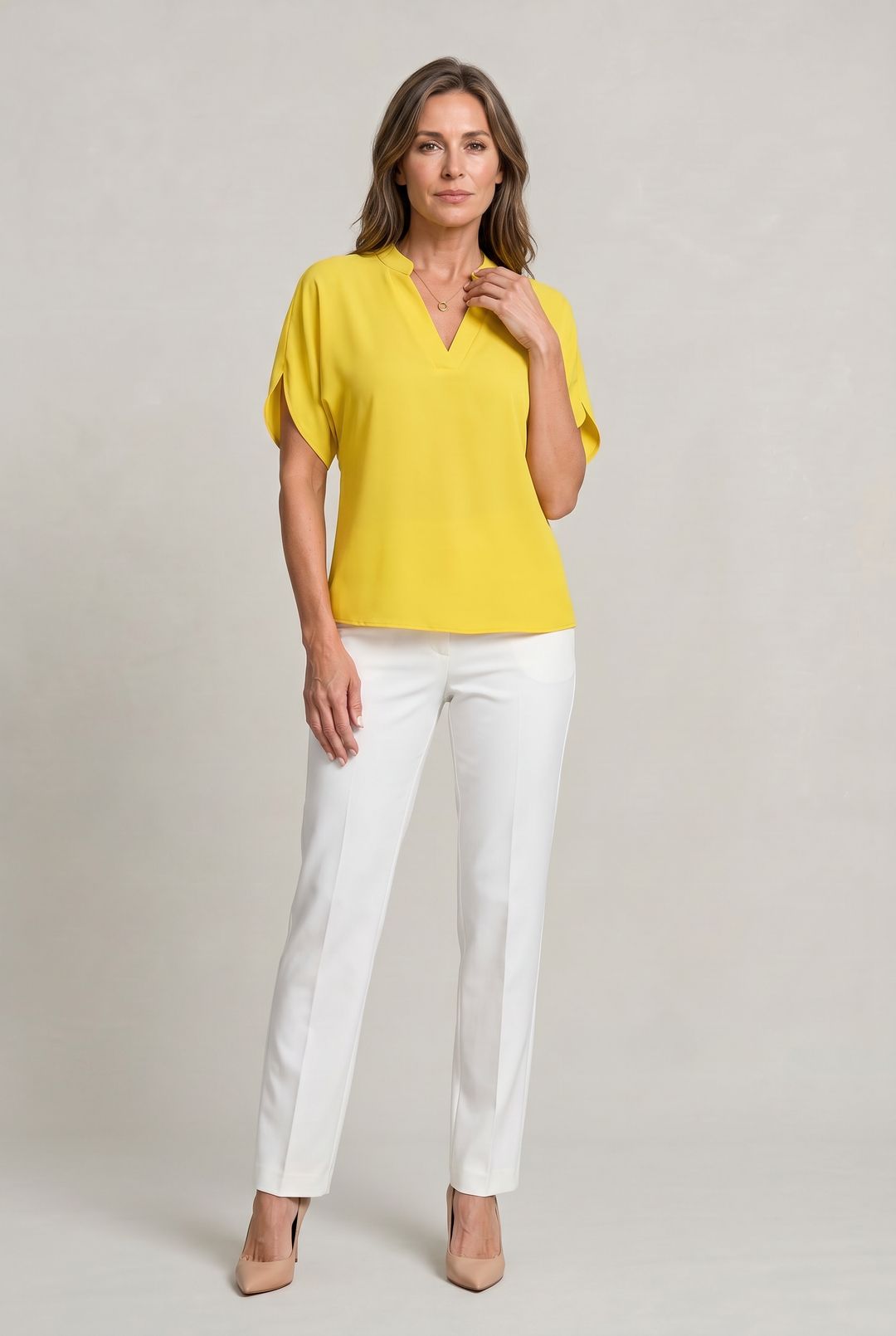 Rosalind notch V-neck petal sleeve top in Green – worn by model