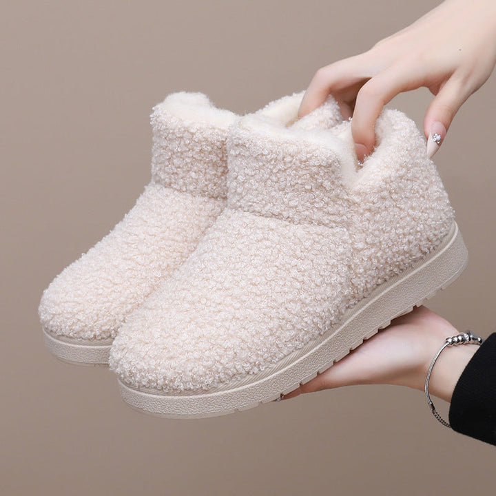 Women's slipper boots Sybil in Cream – held in hand