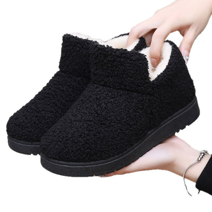 Women's slipper boots Sybil in Black – held in hand