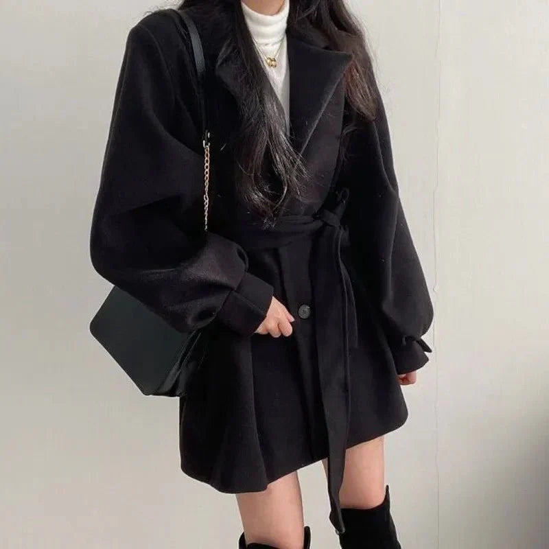 Women's belted short coat Clementina in Black – styled with shoulder bag