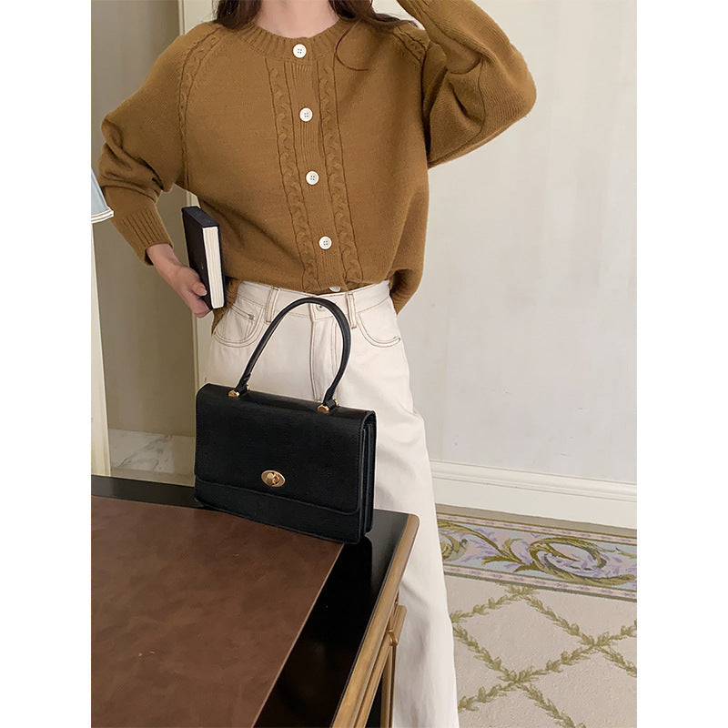 Women's cable knit cardigan Etta in Camel – styled with bag