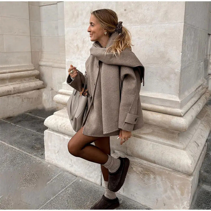 Women's scarf jacket Isobelle in Khaki – seated outdoors