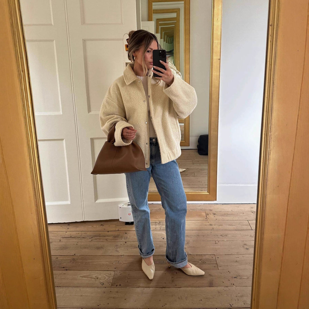 Women's teddy jacket Rosina in Cream White – mirror view worn with jeans