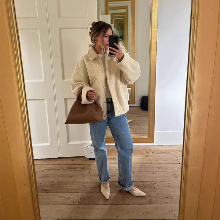 Women's teddy jacket Rosina in Cream White – mirror view worn with jeans