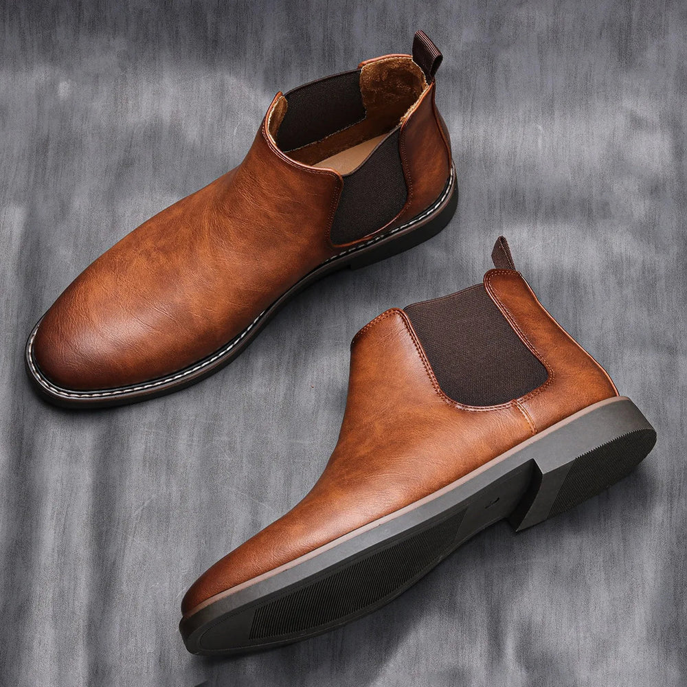 Men's classic Chelsea boots Bruno in Brown – pair on grey fabric