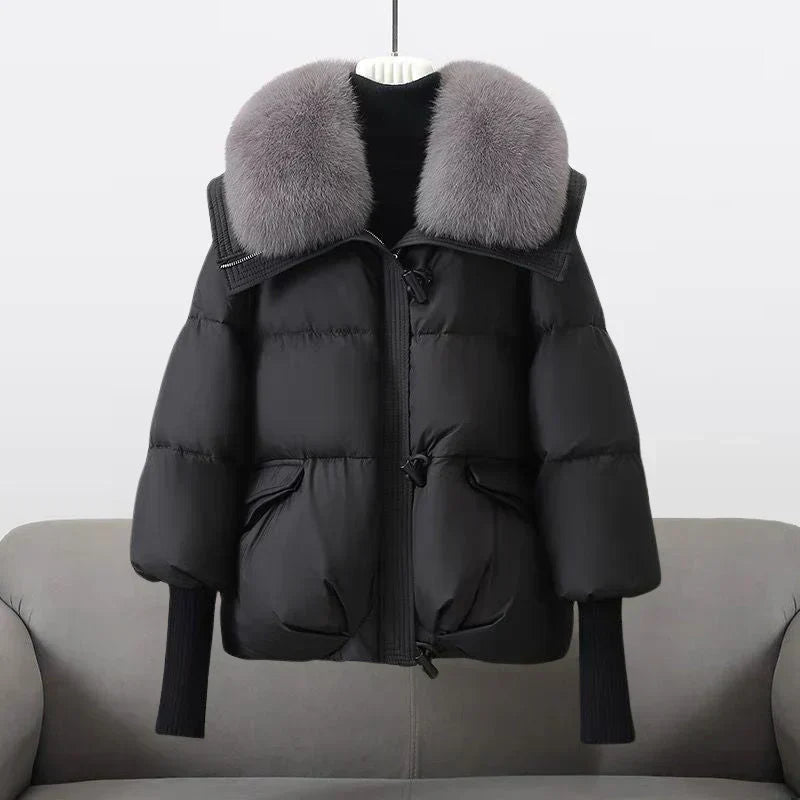 Cheltenham women's puffer jacket in Black – front view on hanger