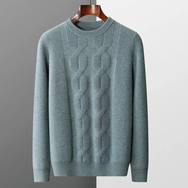 Men's sage green chunky cable knit jumper – front view on hanger