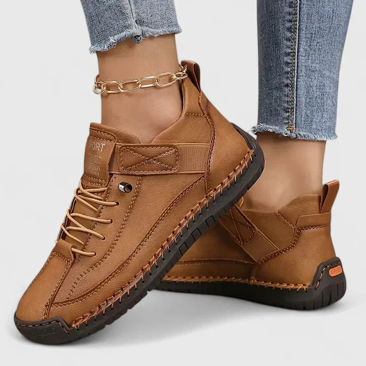 Women's lace up trainers Yvie in Brown – on foot side view