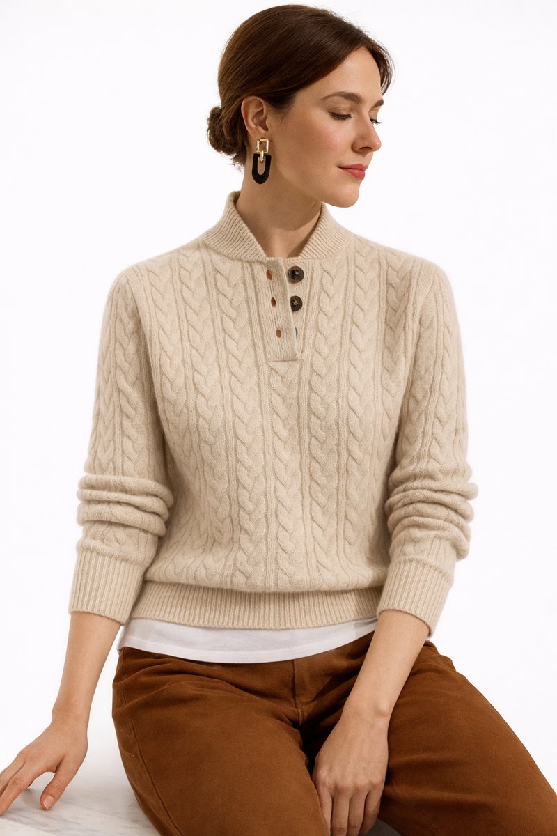 Women's cable knit jumper Ysolde in Khaki – seated close-up of button collar