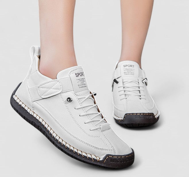 Women's lace up trainers Yvie in White – on foot front and side view