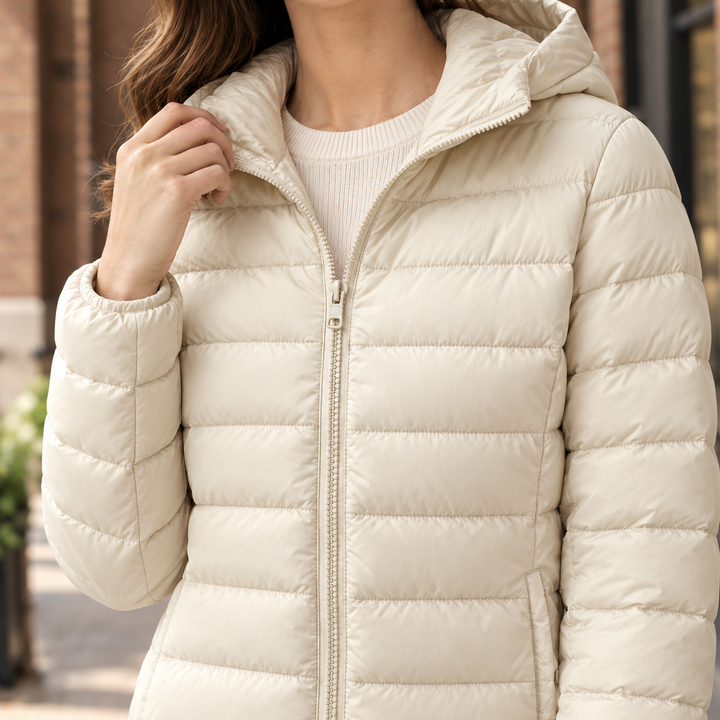 Goring women's puffer jacket in Cream – close-up front view of hood and zip