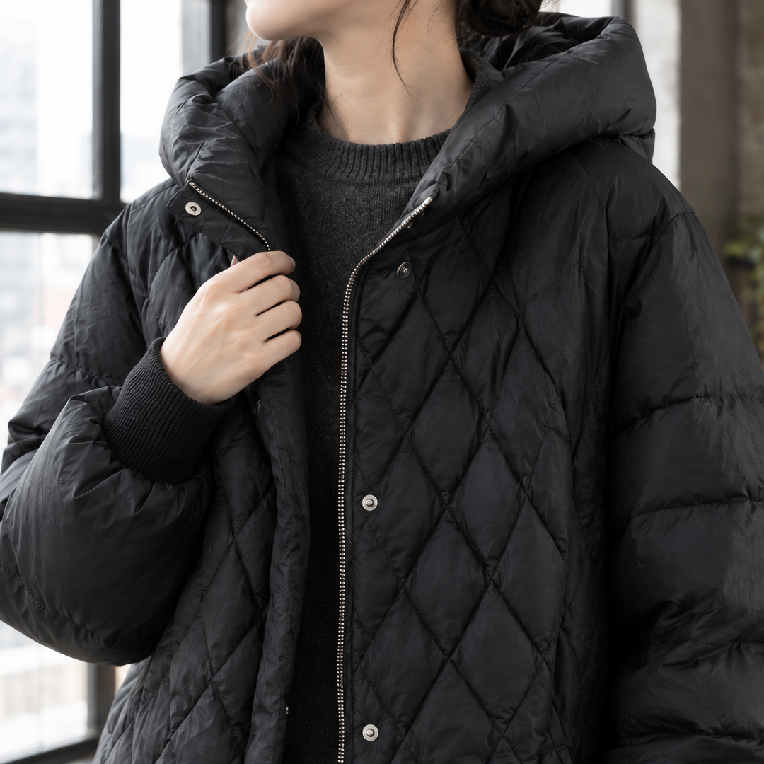 Masham women's puffer jacket in Black – close-up front view of hood and zip