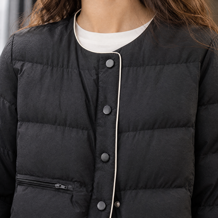 Sedbergh women's quilted down jacket in Black – piping and snap-front close-up