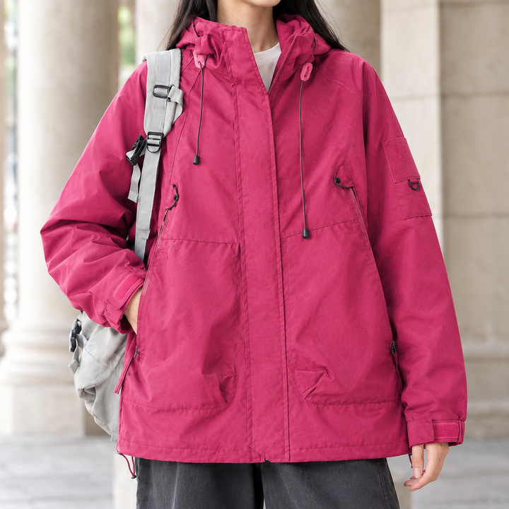 Stirling women's utility jacket in Raspberry – close-up front view of hood and pockets