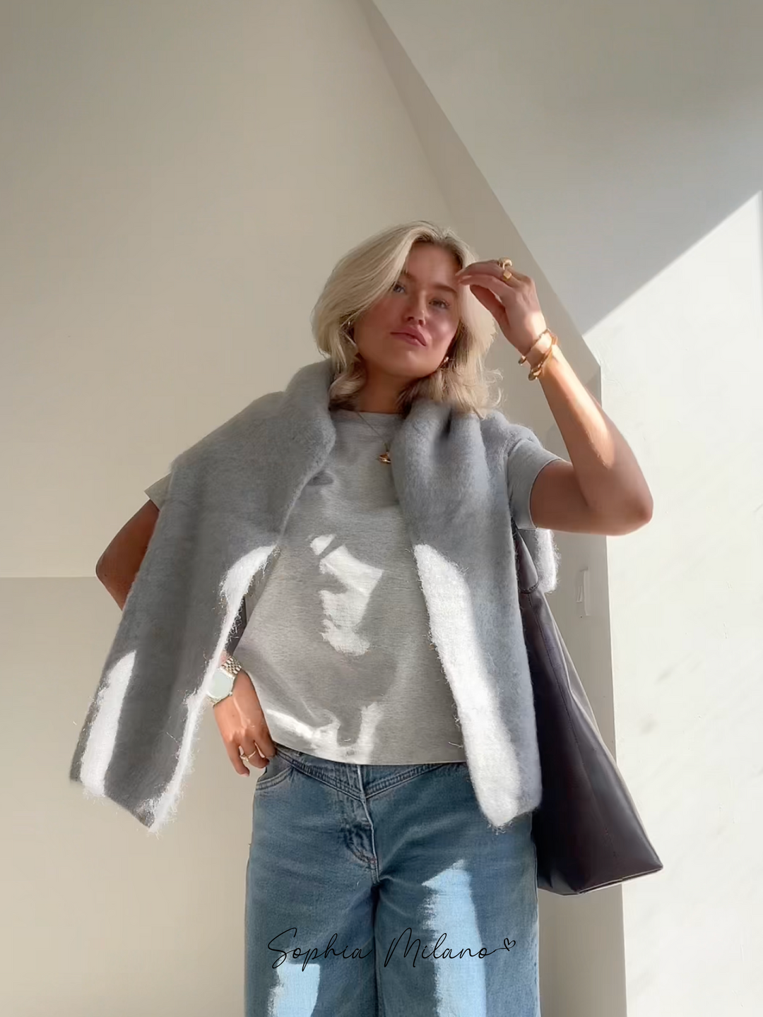 Women's fluffy knit crew neck jumper Darcey in Grey – draped over shoulders
