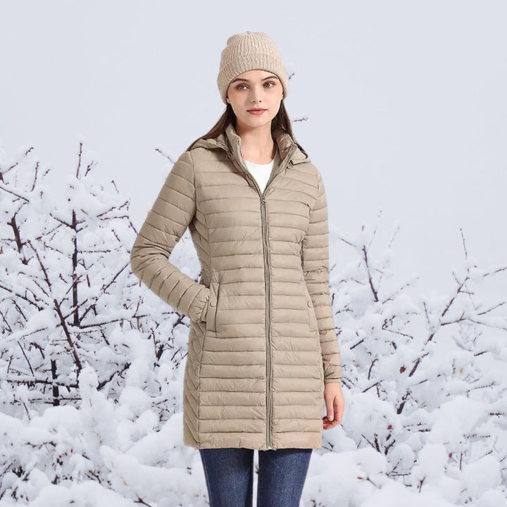 Women's long puffer coat Justina in Beige – worn front view