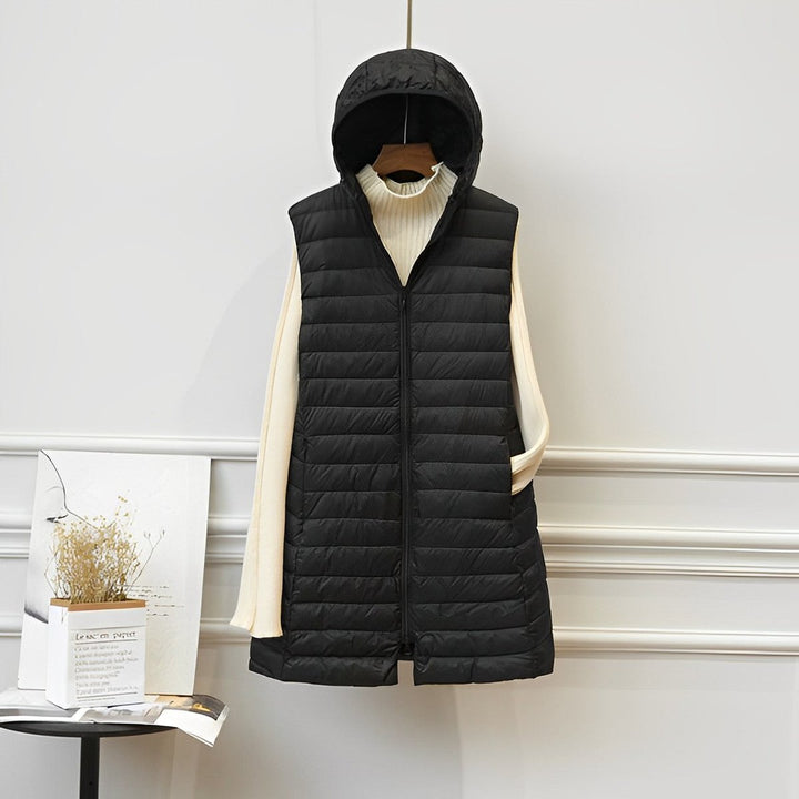 Women's long quilted gilet Ernestina in Black – front view on hanger